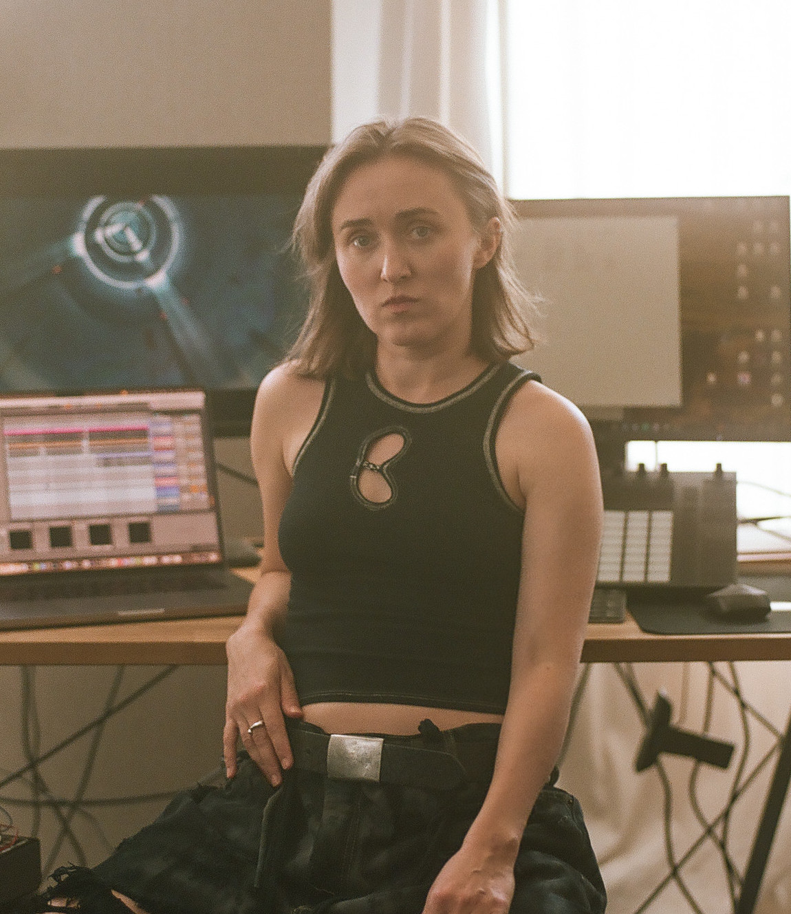 Photo of VOLA Default in front of her setup