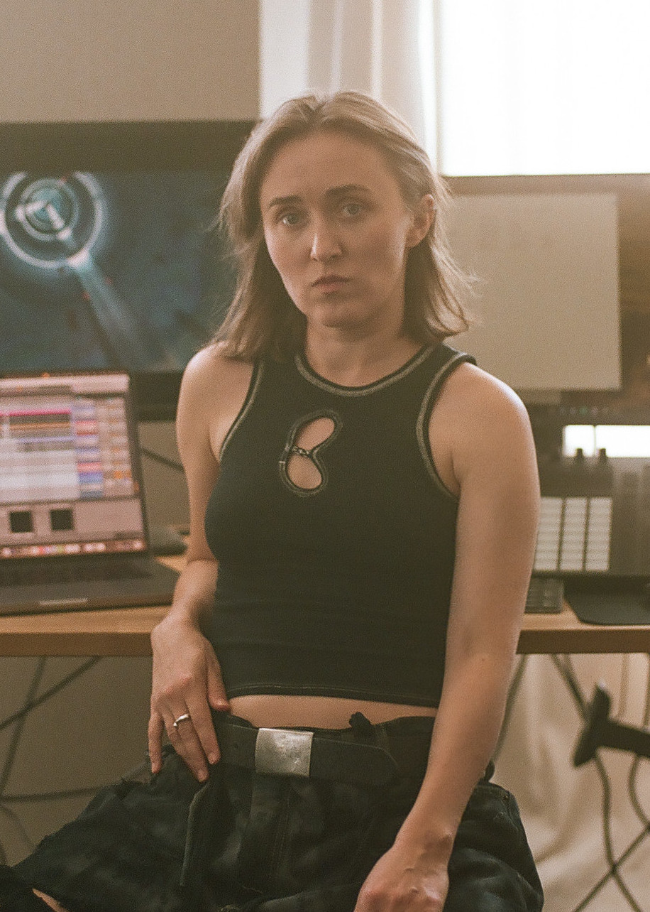 Photo of VOLA Default in front of her setup