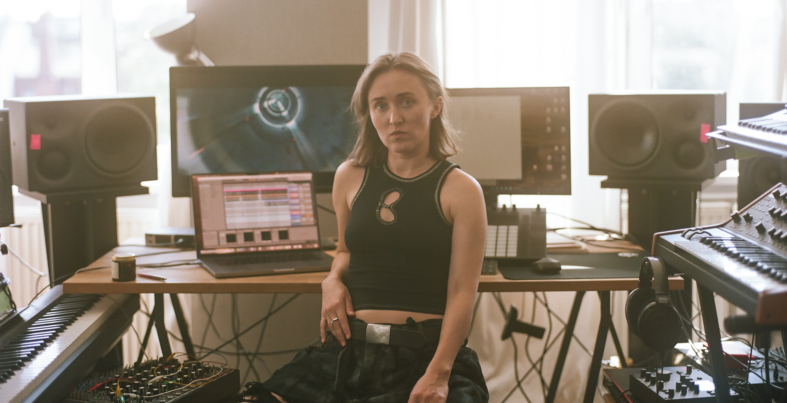 Photo of VOLA Default in front of her setup