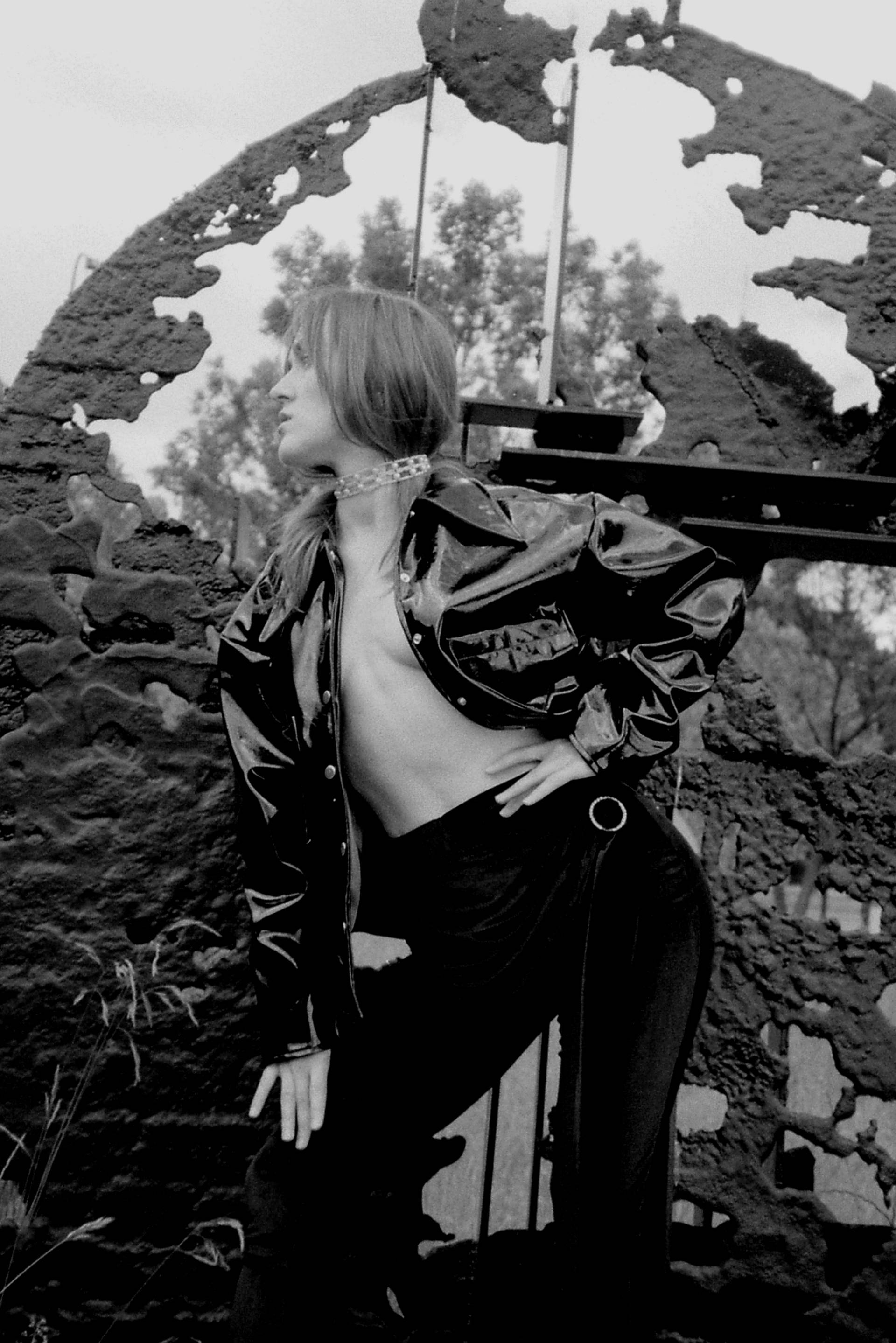 Photo of VOLA Default posing in front of a piece of art