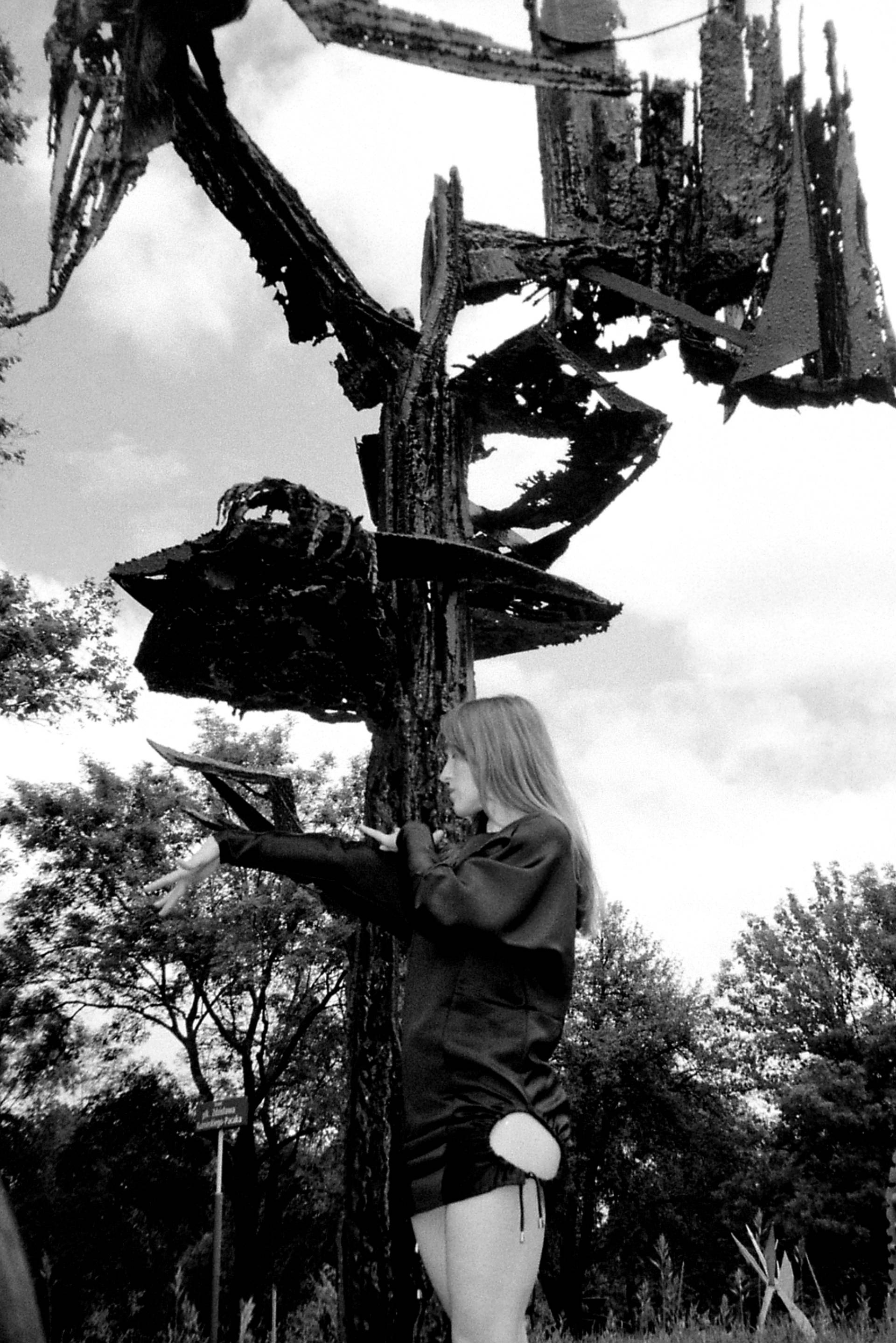 Photo of VOLA Default posing in front of a piece of art